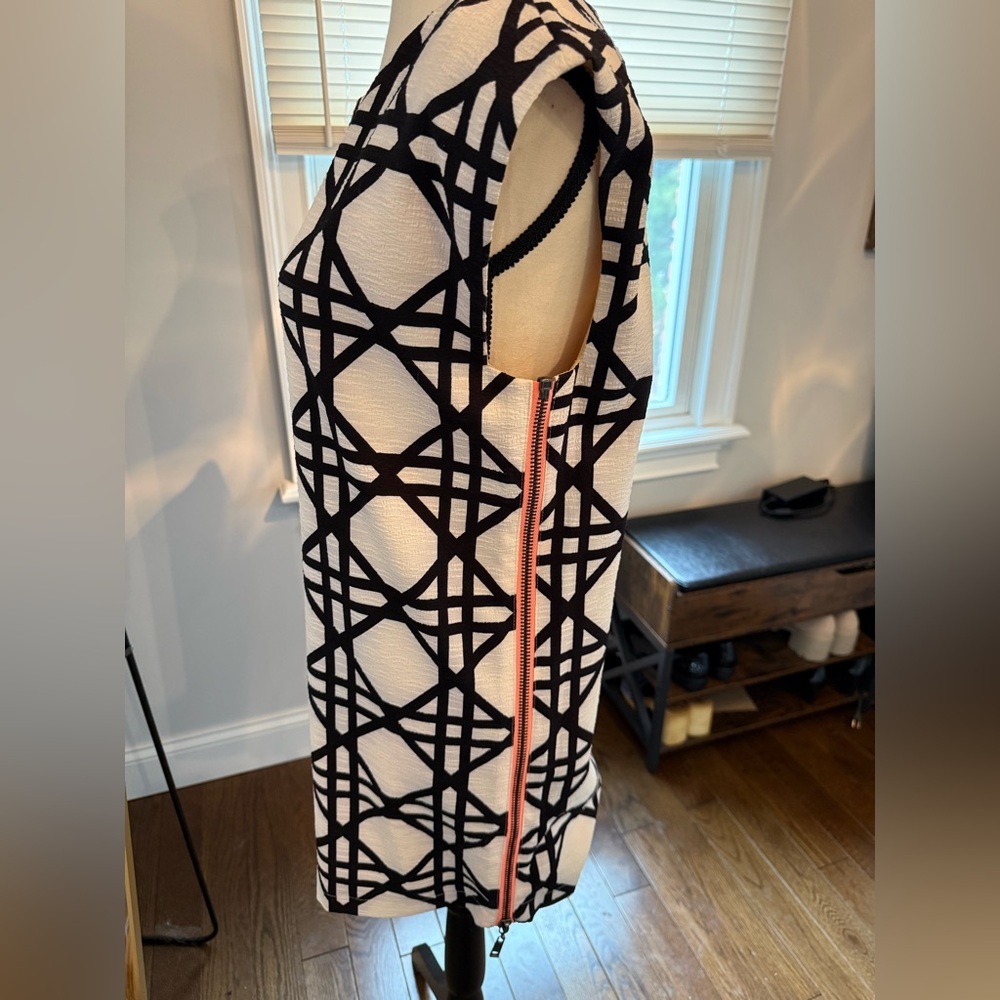 Elegant Black and White Geometric Mini Dress with Coral Zipper